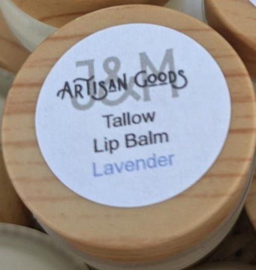 'J&M Artisan Goods' Lavender Tallow Lip balm, with wooden lid.